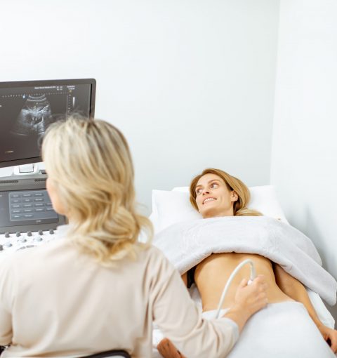 doctor-performs-ultrasound-examination-of-a-woman-2022-01-18-23-54-06-utc